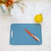 Blue silicone cutting board with a red KiddiKutter knife